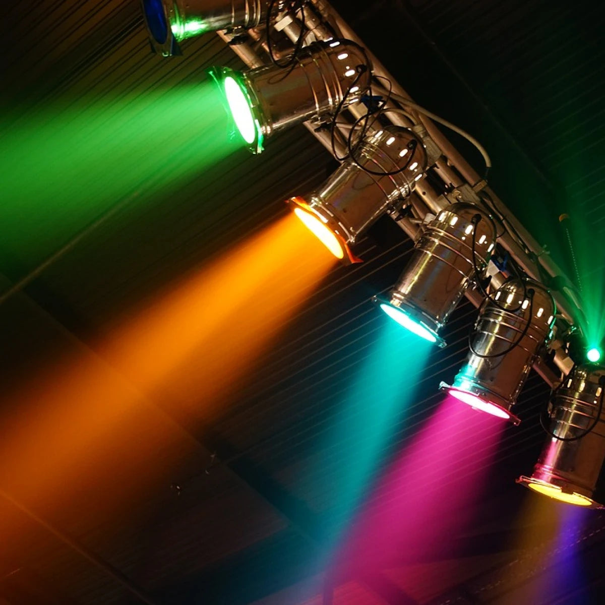 Stage lighting over booth display, illustrating photo booth offerings for event rentals.