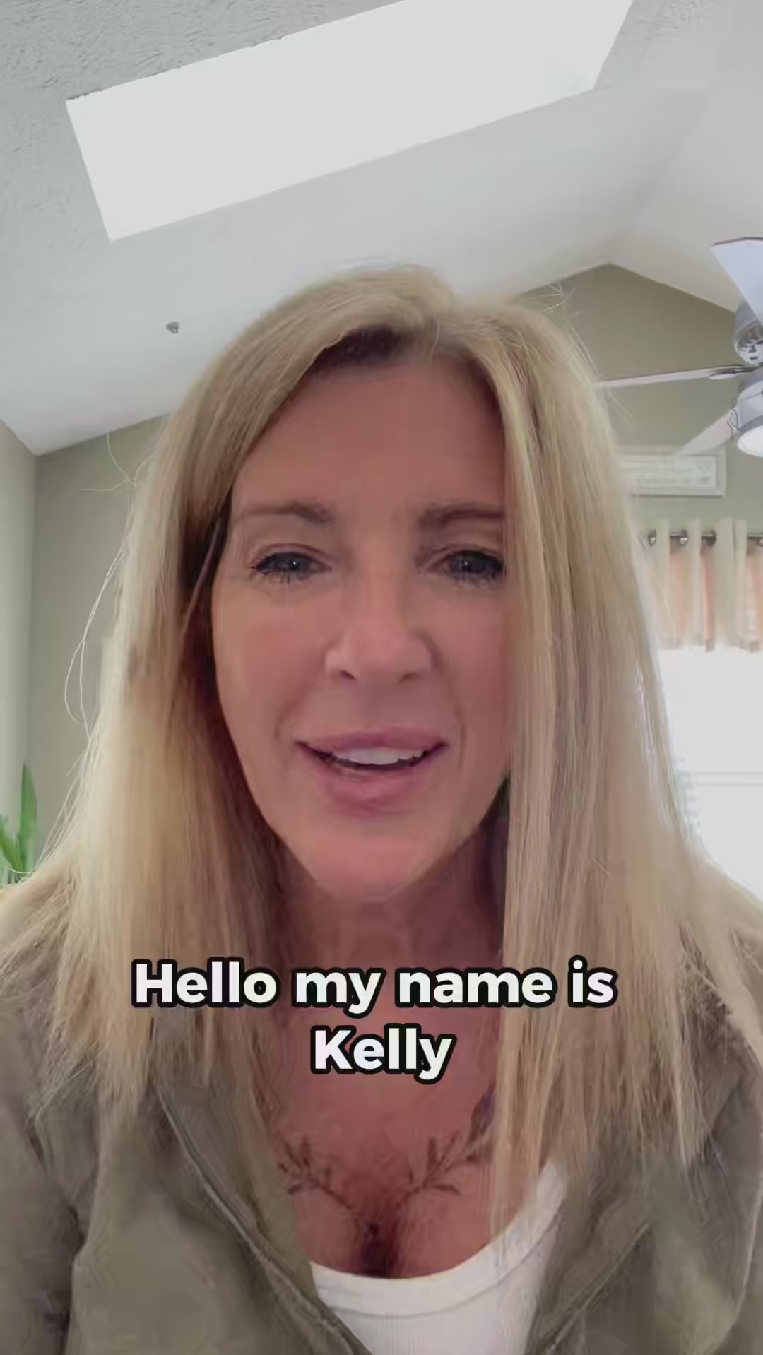 Close-up of smiling woman with long blonde hair (Kelly Farrell) of Mirrored Image Photo Booth, promoting photo booth use.