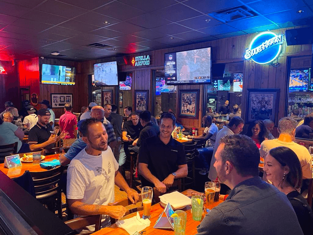 Guests socializing over drinks at a Foto Master customer mixer