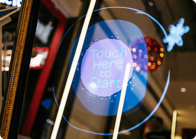 Interactive screen with "Touch Here to Start" prompt.