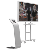 Augmented Reality Photo Booth setup with interactive kiosk and large display screen showing augmented scenes.
