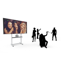 Guests using selfie station as Selfie Wi-Fi displays group photo on screen