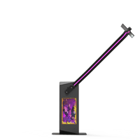 V-Motion 180 photo booth with extended arm and vibrant screen.